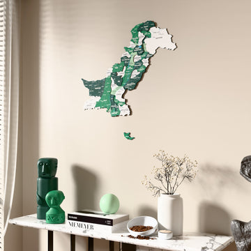 Flag colored Pakistan wooden wall map beside a sheer curtain, angled view