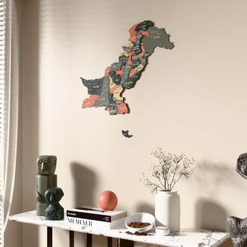Sage Pakistan wooden wall map beside a sheer curtain, angled view
