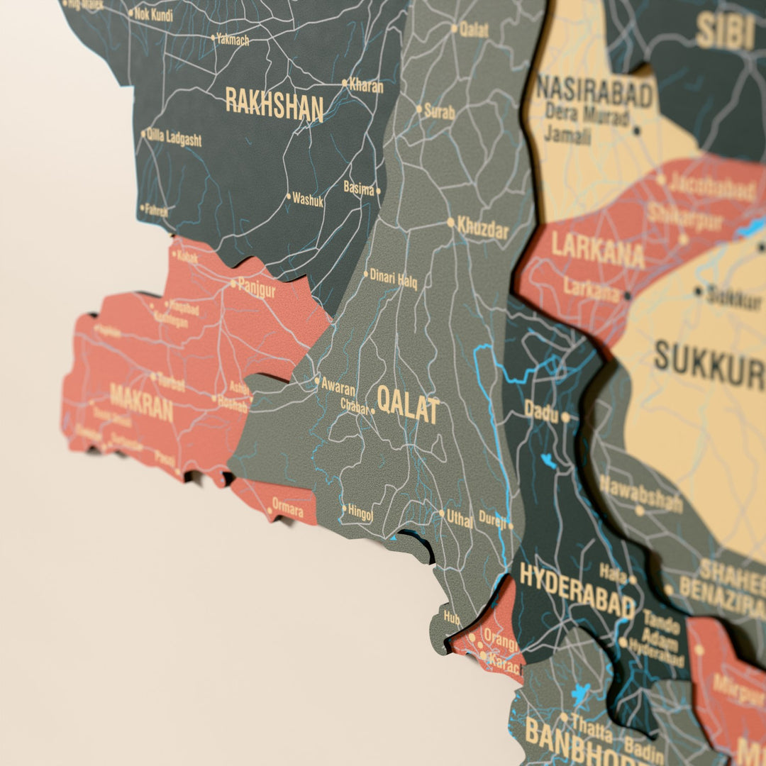 Close-up of the Sage Pakistan wooden wall map with layered regions and printed names