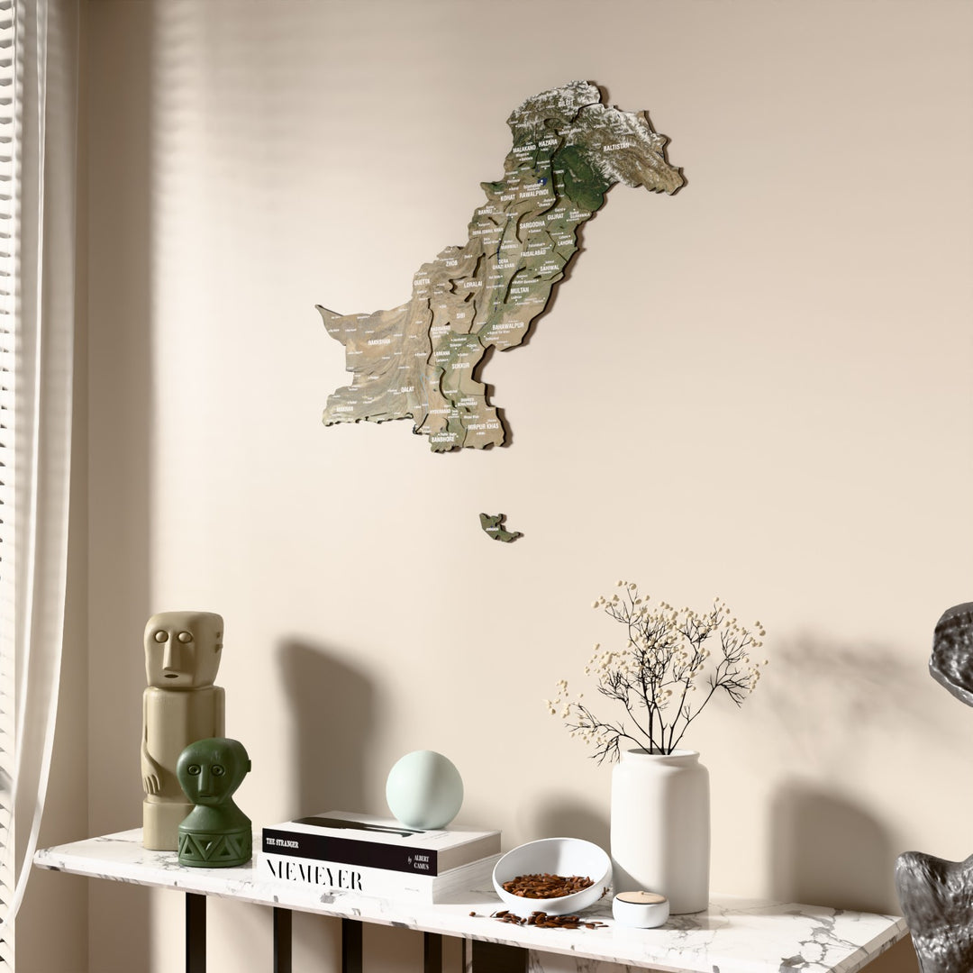 Satellite Pakistan wooden wall map beside a sheer curtain, angled view