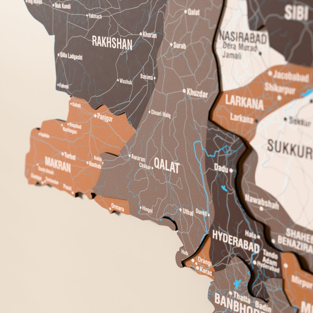 Close-up of the Soil Pakistan wooden wall map with layered regions and printed names