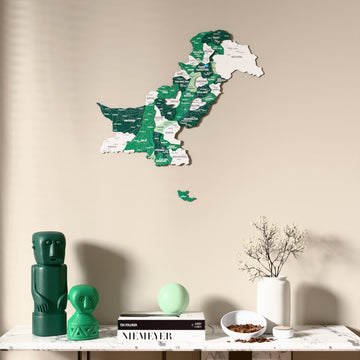 Flag colored Pakistan wooden wall map above a marble console, front view