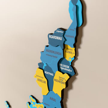 Close-up of the Flag colored Palau wooden wall map with layered regions and printed names