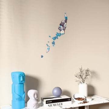 Nimbus Palau wooden wall map on a beige wall above a console with figurines