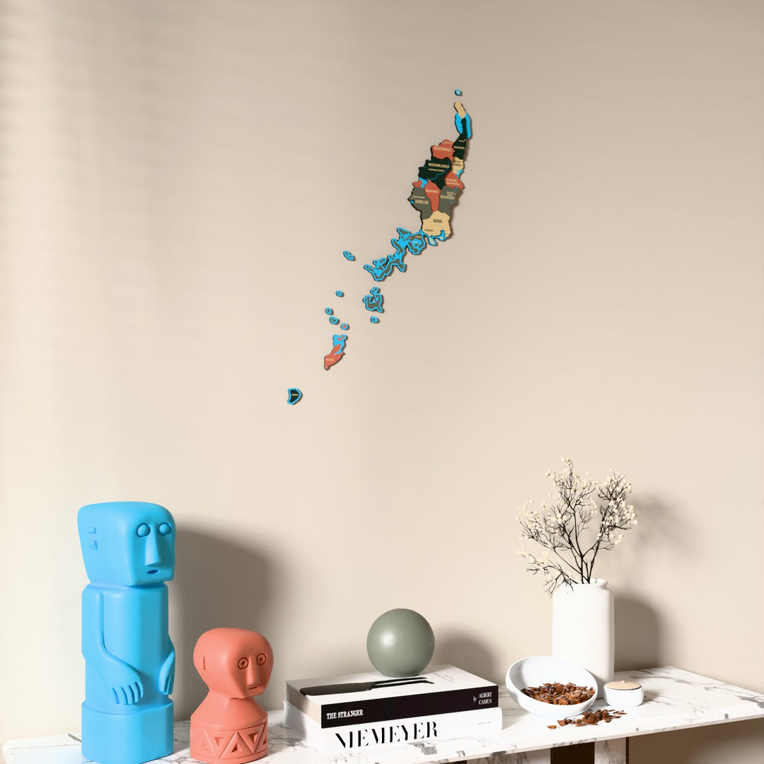 Sage Palau wooden wall map on a beige wall above a console with figurines