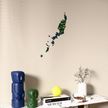Satellite Palau wooden wall map on a beige wall above a console with figurines