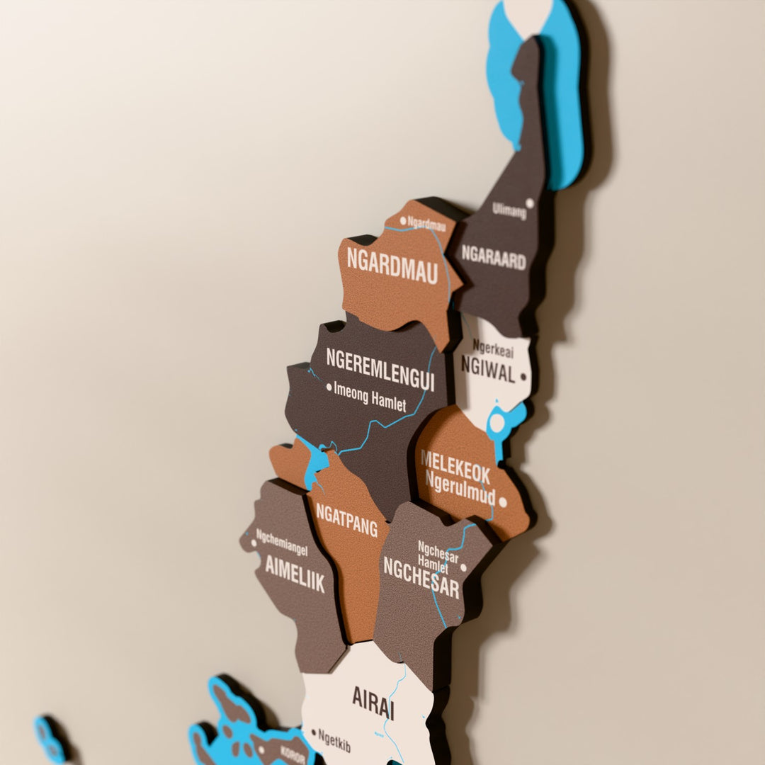 Close-up of the Soil Palau wooden wall map with layered regions and printed names