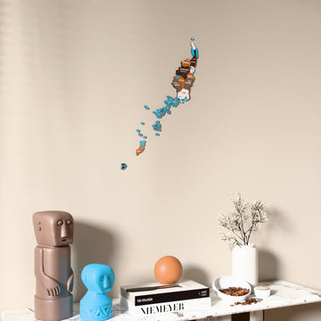 Soil Palau wooden wall map on a beige wall above a console with figurines