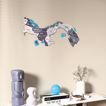 Nimbus Panama wooden wall map on a beige wall above a console with figurines