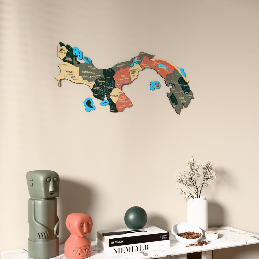 Sage Panama wooden wall map on a beige wall above a console with figurines