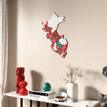 Flag colored Peru wooden wall map beside a sheer curtain, angled view