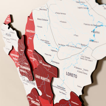 Close-up of the Flag colored Peru wooden wall map with layered regions and printed names