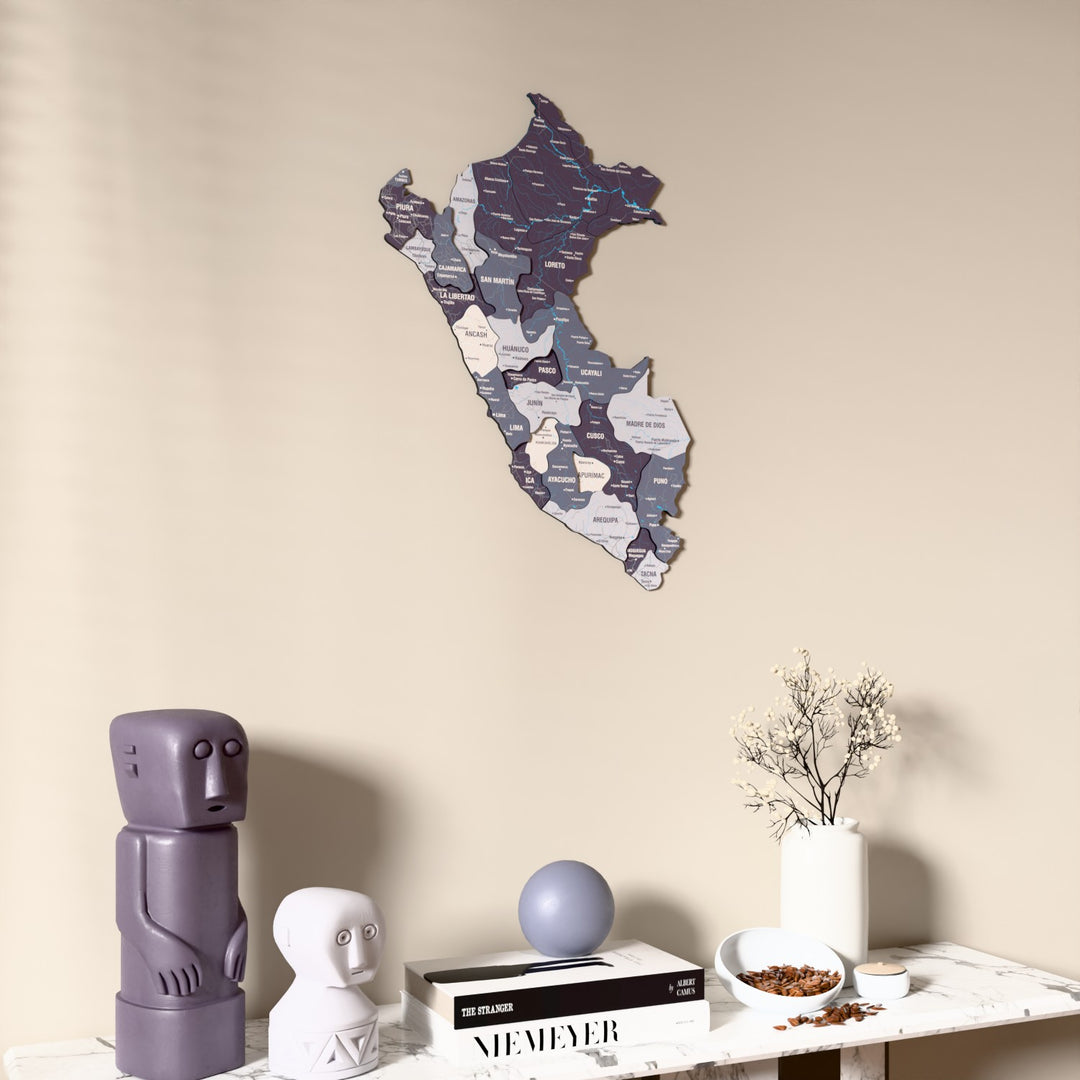 Nimbus Peru wooden wall map on a beige wall above a console with figurines