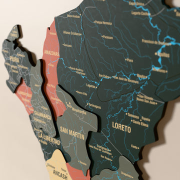 Close-up of the Sage Peru wooden wall map with layered regions and printed names