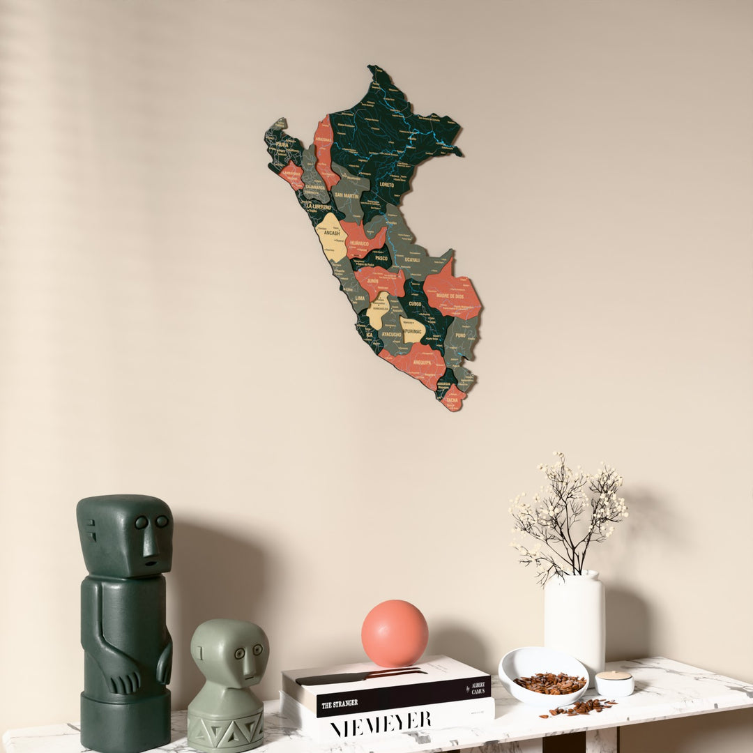 Sage Peru wooden wall map on a beige wall above a console with figurines