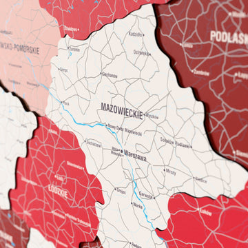 Close-up of the Flag colored Poland wooden wall map with layered regions and printed names