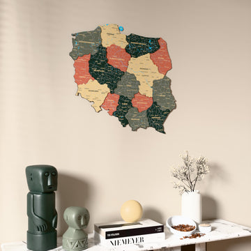Sage Poland wooden wall map on a beige wall above a console with figurines