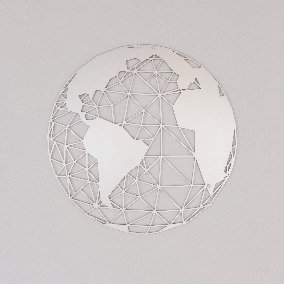 Silver polygon world map metal wall art on a grey wall, front view