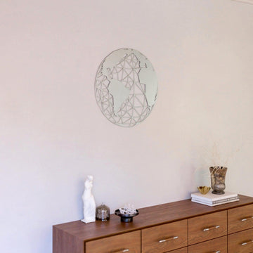 Silver polygon world map metal wall art above a dresser, wide room shot