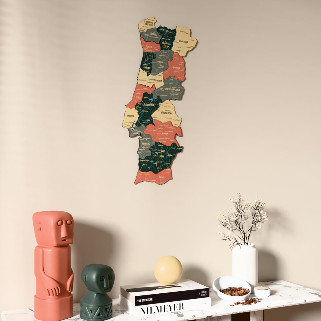Sage Portugal wooden wall map on a beige wall above a console with figurines