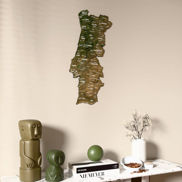 Satellite Portugal wooden wall map on a beige wall above a console with figurines