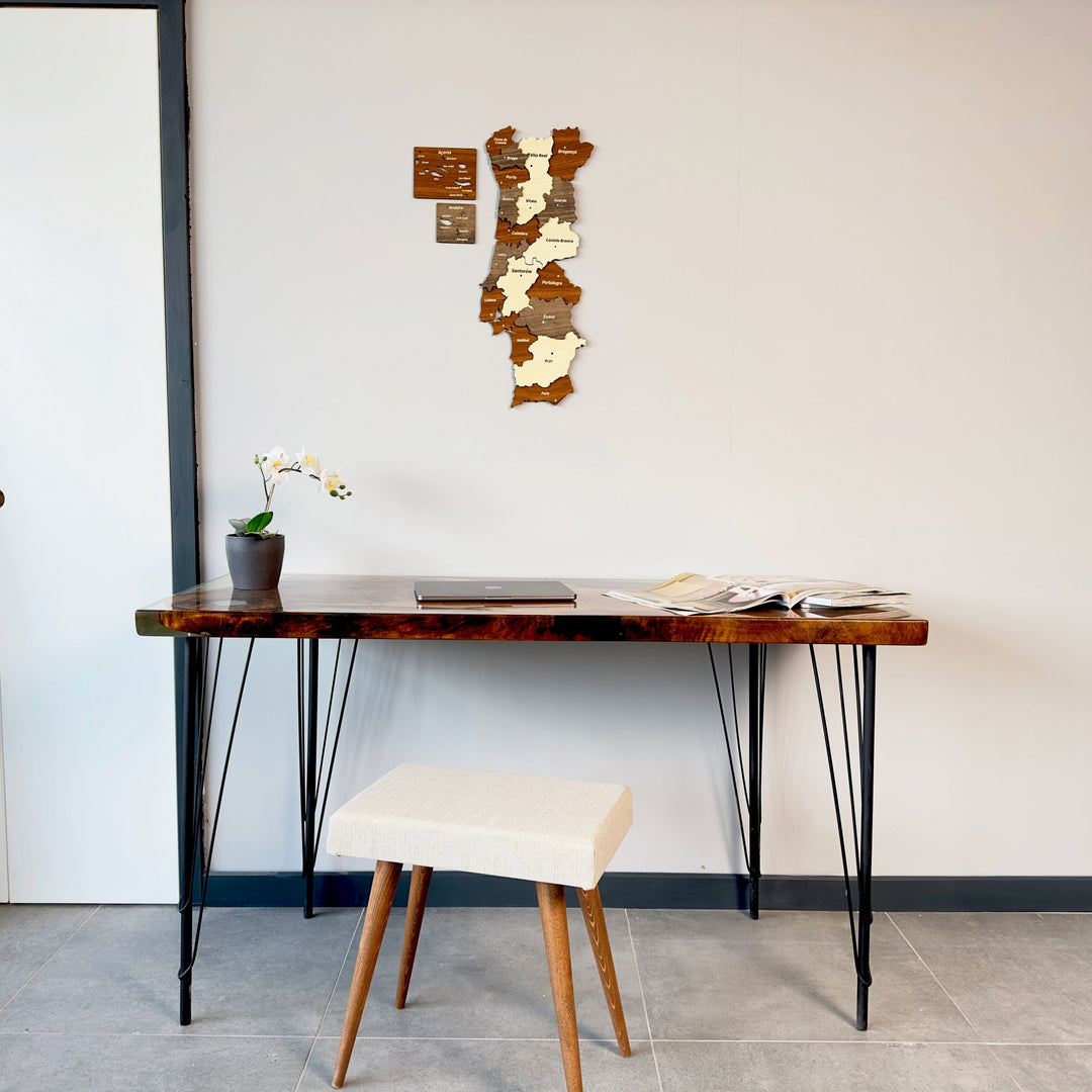 Portugal wooden wall map above a hairpin-leg desk with a cream stool
