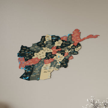 Sage Afghanistan wooden wall map in forest green, sand and terracotta pieces on a plain wall