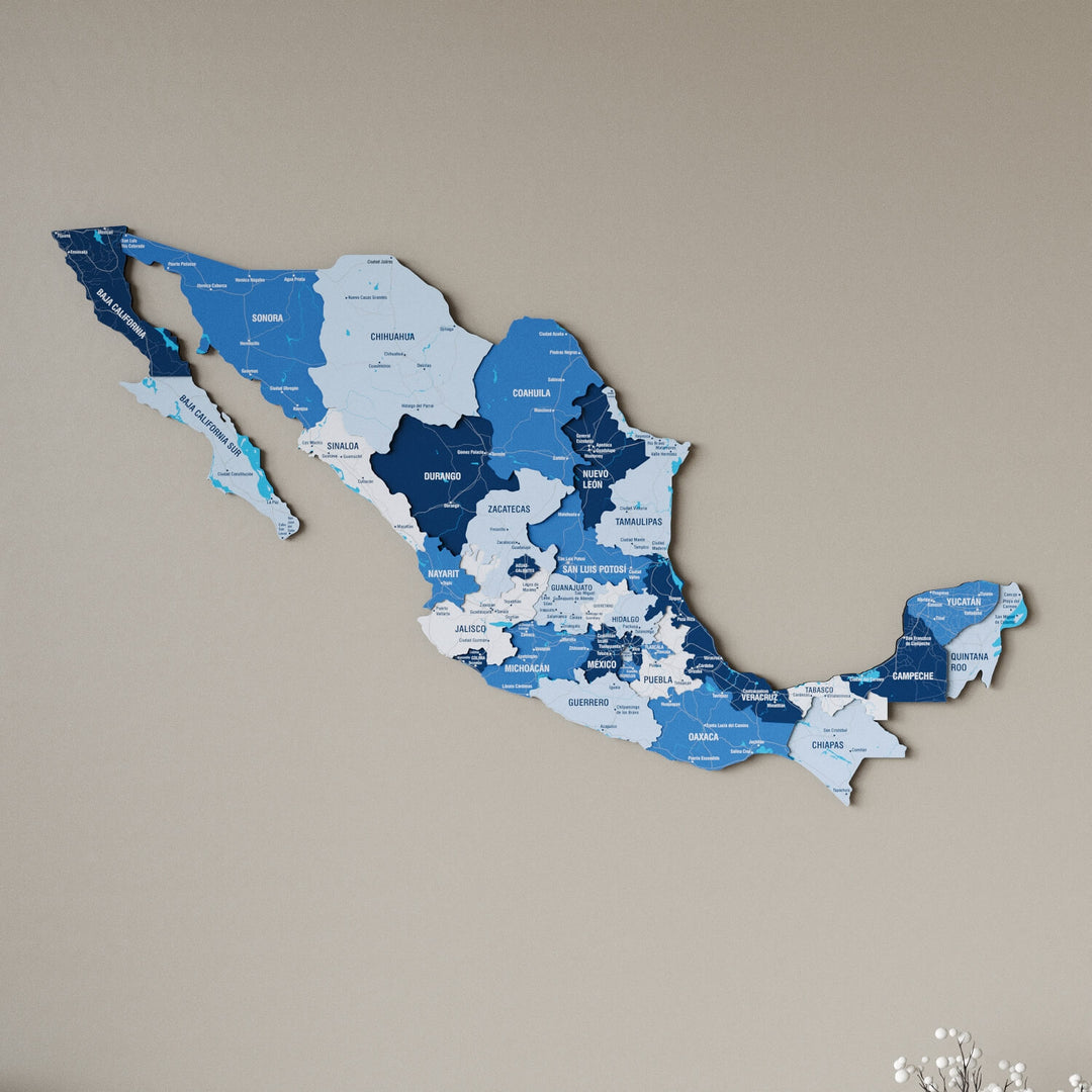 Navy Mexico wooden wall map in shades of blue on a beige wall, angled view showing the layered pieces