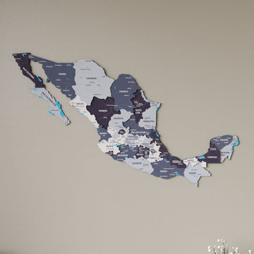 Nimbus Mexico wooden wall map in slate gray and purple tones on a beige wall, angled view showing the layered pieces