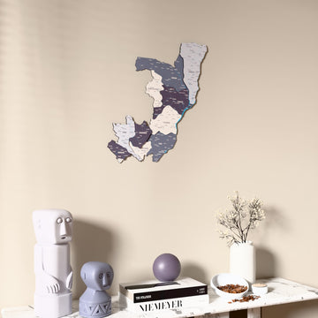 Nimbus Republic of the Congo wooden wall map on a beige wall above a console with figurines