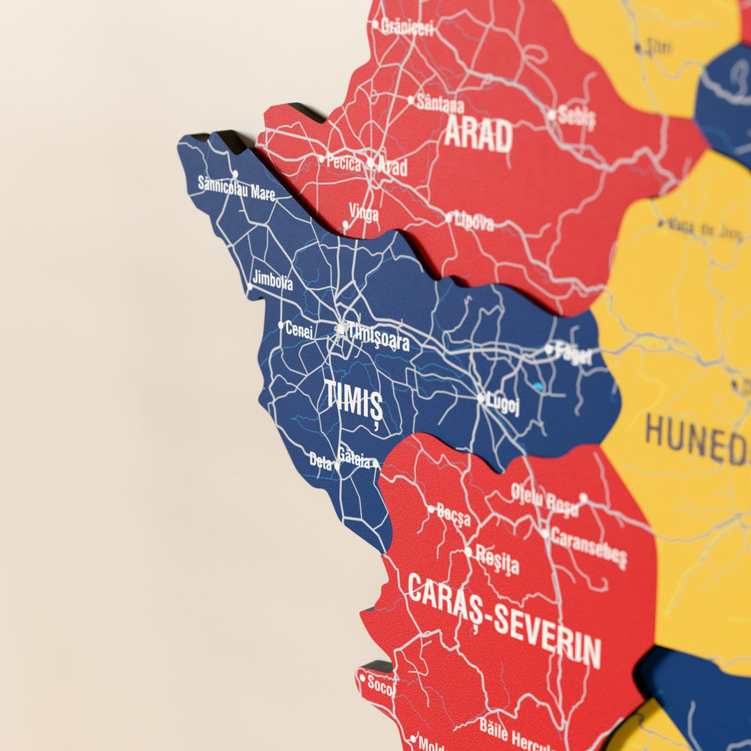 Close-up of the Flag colored Romania wooden wall map with layered regions and printed names