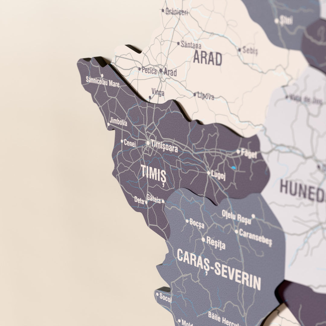 Close-up of the Nimbus Romania wooden wall map with layered regions and printed names