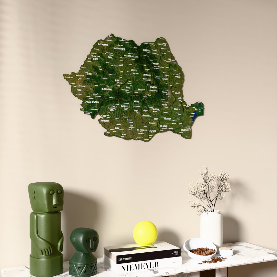 Satellite Romania wooden wall map on a beige wall above a console with figurines