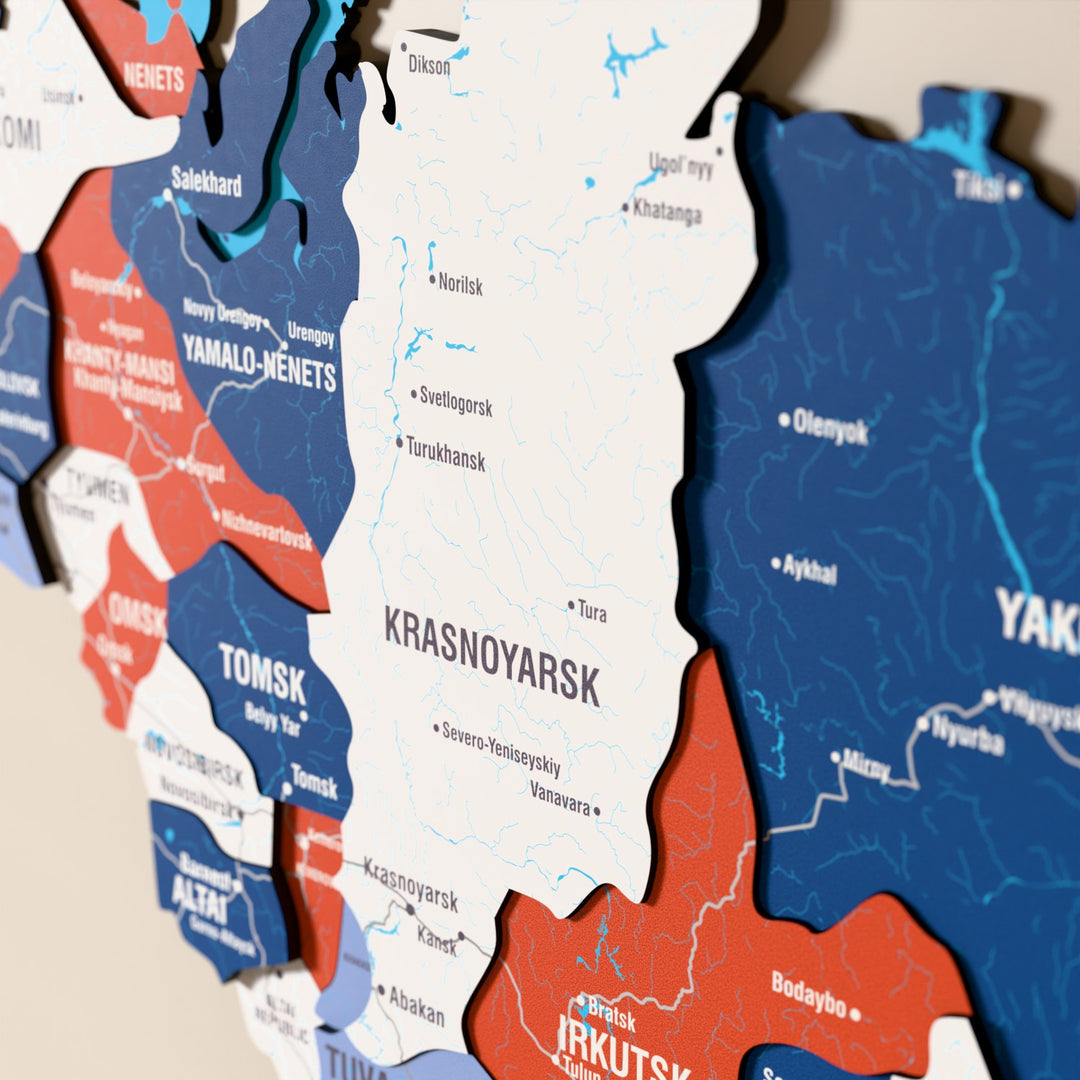 Close-up of the Flag colored Russia wooden wall map with layered regions and printed names