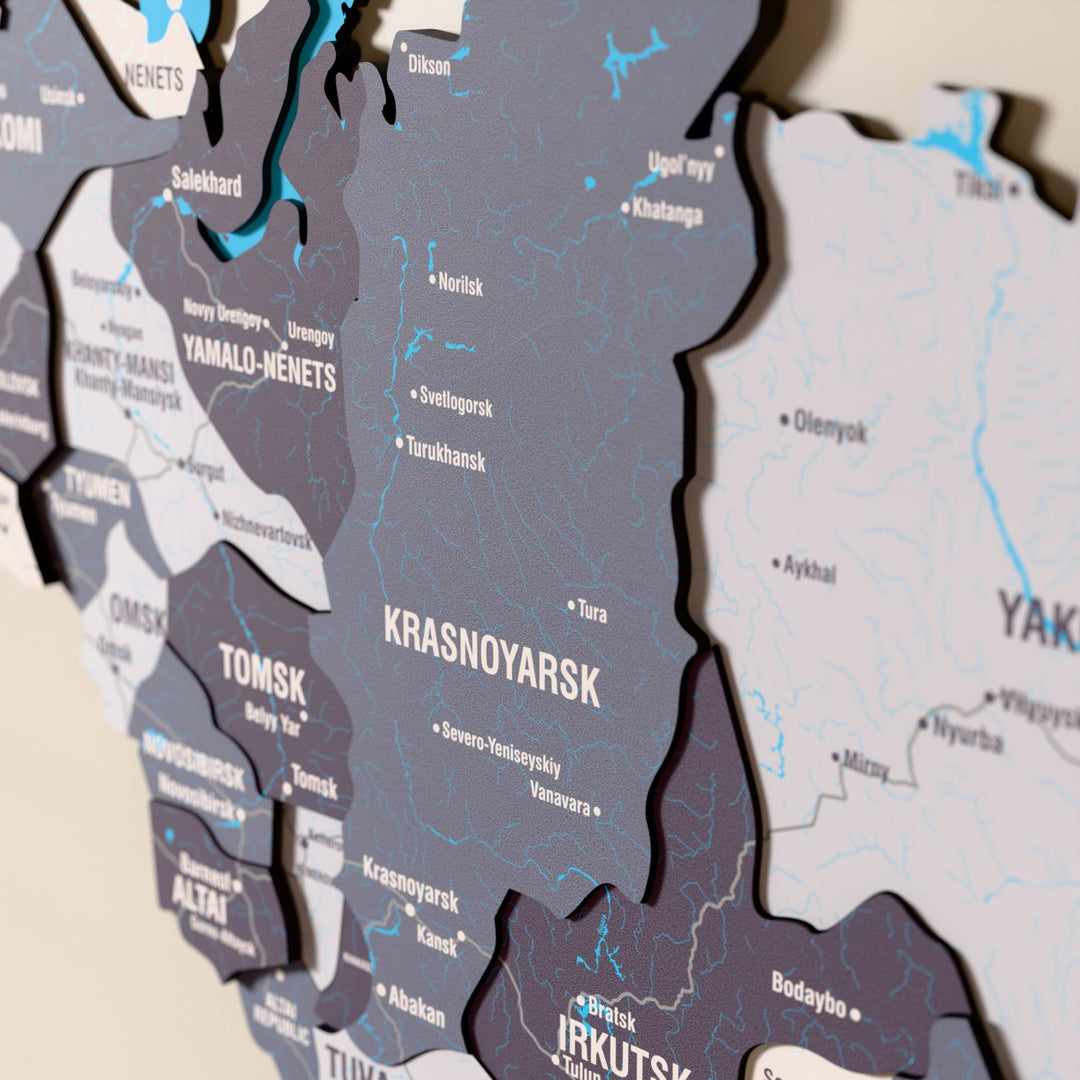Close-up of the Nimbus Russia wooden wall map with layered regions and printed names