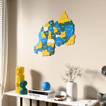 Flag colored Rwanda wooden wall map beside a sheer curtain, angled view