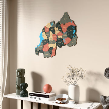 Sage Rwanda wooden wall map beside a sheer curtain, angled view