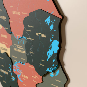 Close-up of the Sage Rwanda wooden wall map with layered regions and printed names