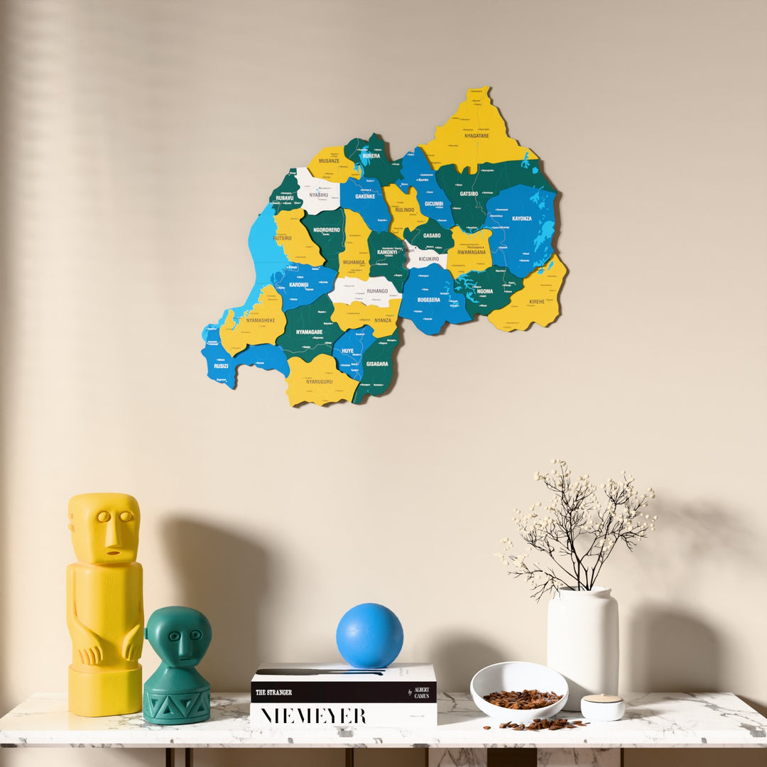 Flag colored Rwanda wooden wall map above a marble console, front view