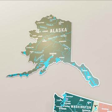 Close-up of the Alaska panel on the sage metal USA map with Anchorage and the Yukon River labeled