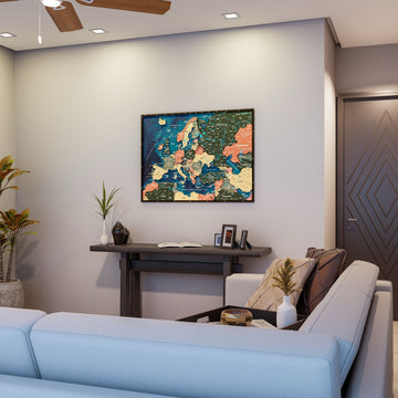 Wooden Europe map with rivers in Sage, above a console table behind a living room sofa