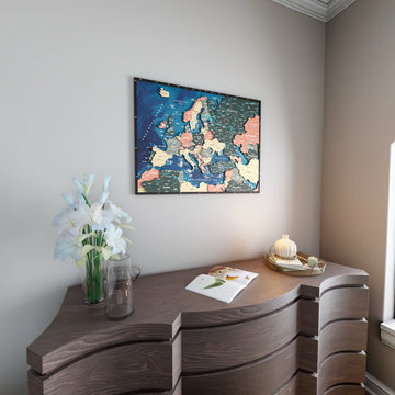 Wooden Europe map with rivers in Sage, above a curved wooden dresser with white lilies
