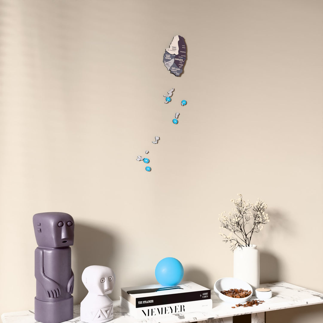 Nimbus Saint Vincent and the Grenadines wooden wall map on a beige wall above a console with figurines
