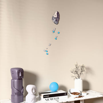 Nimbus Saint Vincent and the Grenadines wooden wall map on a beige wall above a console with figurines
