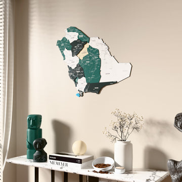 Flag colored Saudi Arabia wooden wall map beside a sheer curtain, angled view