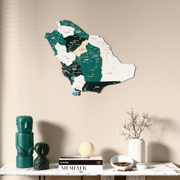Flag colored Saudi Arabia wooden wall map above a marble console, front view