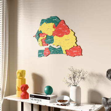 Flag colored Senegal wooden wall map beside a sheer curtain, angled view