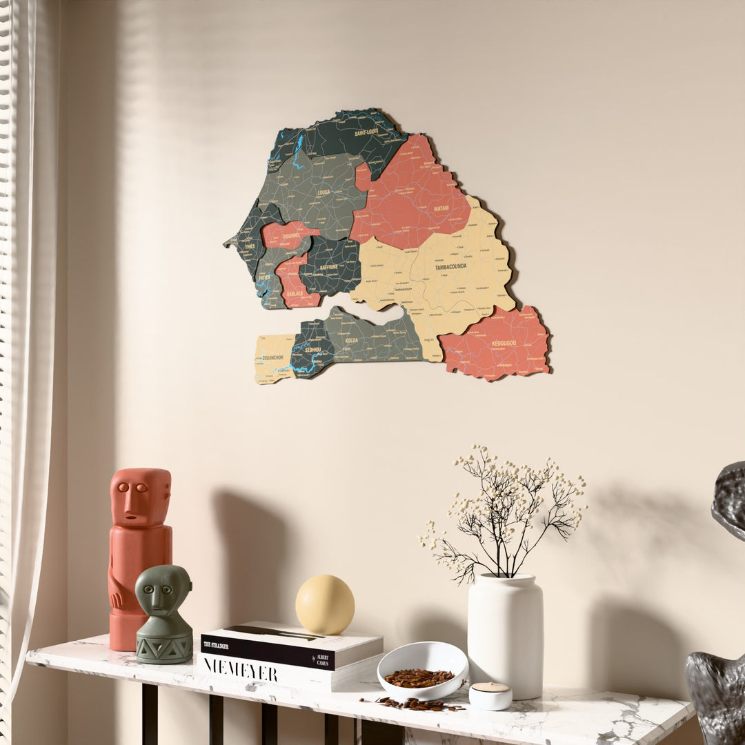Sage Senegal wooden wall map beside a sheer curtain, angled view