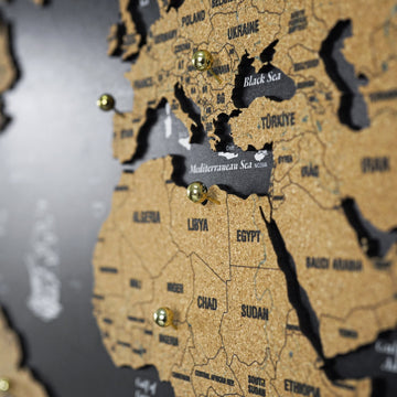 Close-up of the Mediterranean, North Africa and the Black Sea on the cork world map with gold push pins