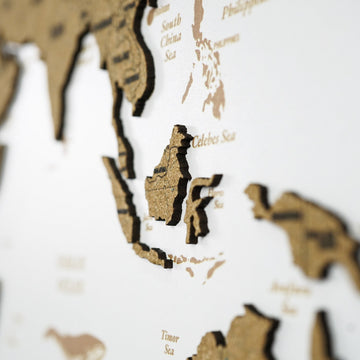 Blurred close-up of Southeast Asia on the white cork world map, with Indonesia and the Celebes Sea